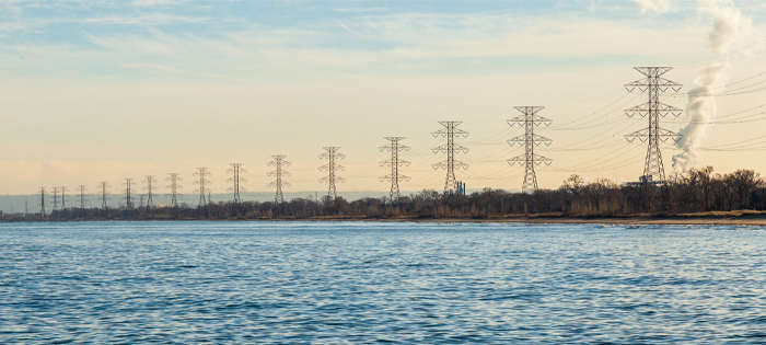 A row of pylons on the waterside