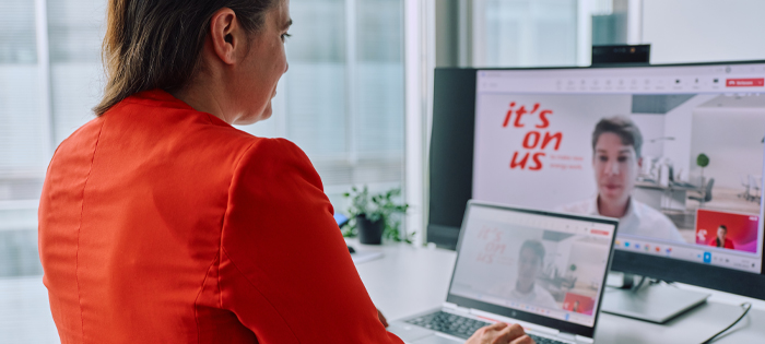 A person looking at E.ON websites on a laptop and larger screen