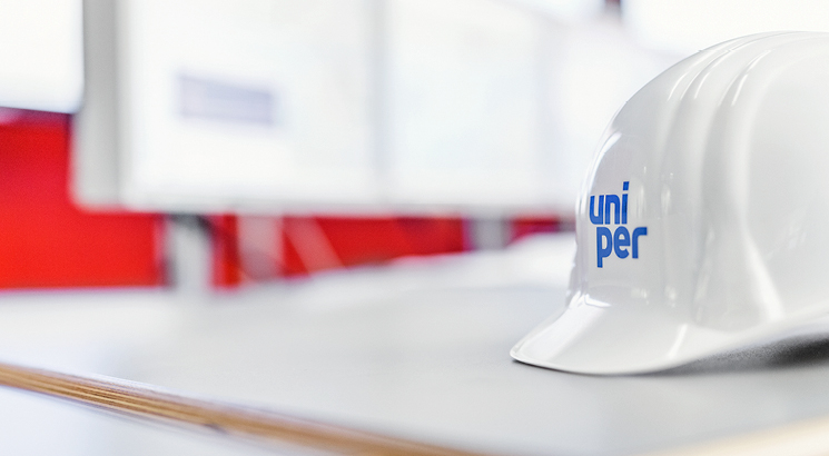 Close up of a white, Uniper branded, hard hat